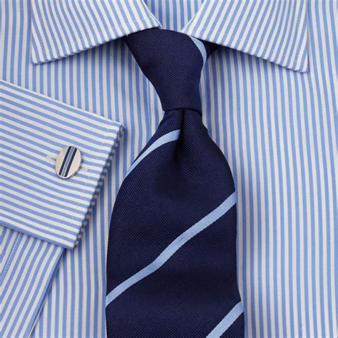 dark blue shirt matching tie.